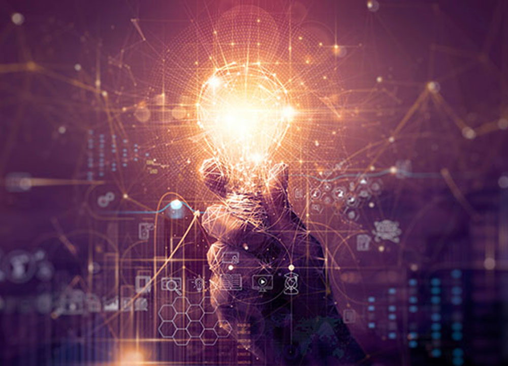 A hand holding a lightbulb