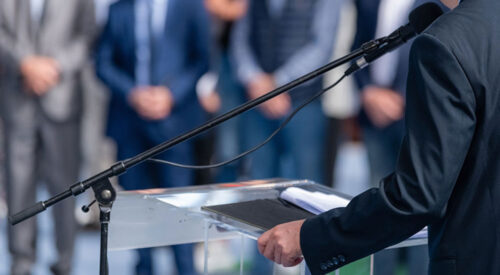 A speaker at a podium