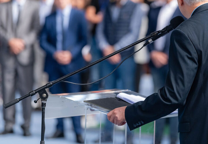 A speaker at a podium