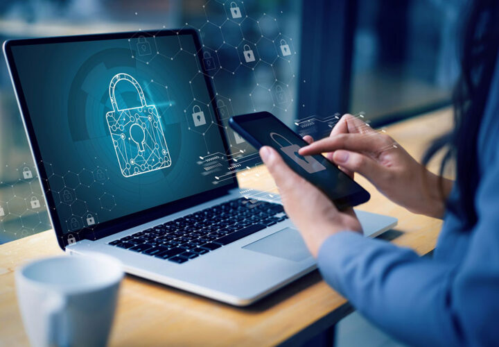 A woman with laptop and mobile phone